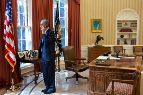 President Barack Obama talks on the phone with a foreign leader in the Oval Office, Nov. 8, 2012. (Official White House Photo by Pete Souza)